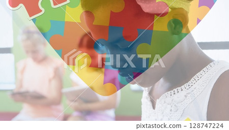 Image of puzzle over diverse schoolchildren 128747224