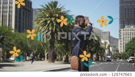 Image of flowers over african american man crossing street 128747663