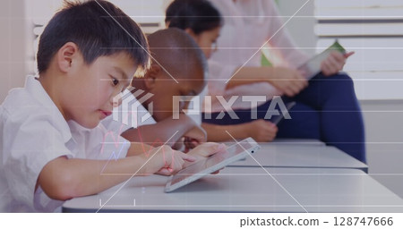 Image of data processing over diverse schoolchildren using tablets in classroom Image of data processing over diverse schoolchildren using tablets in classroom 128747666