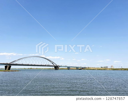 River, overpass and blue sky River, overpass and blue sky 128747857