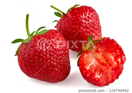 three red appetizing strawberries isolated on a white background three red appetizing strawberries isolated on a white background 128748402