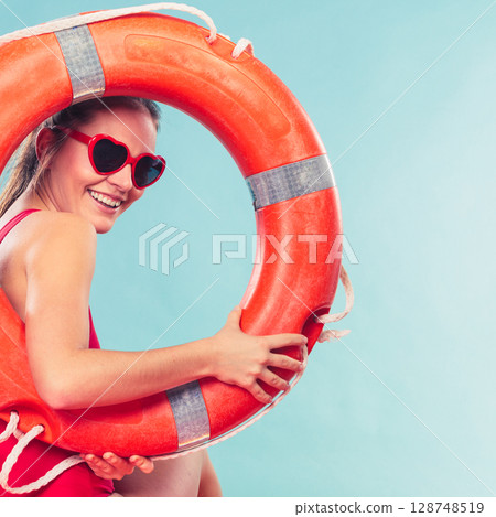 Happy woman in sunglasses with ring buoy lifebuoy. 128748519