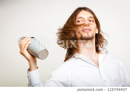 Long haired barman shaking head. 128749407