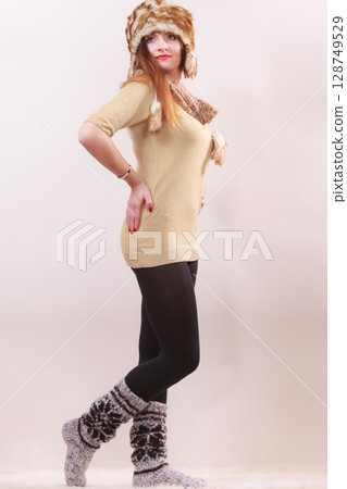 Beautiful winter woman in warm clothing Beautiful winter woman in warm clothing 128749529
