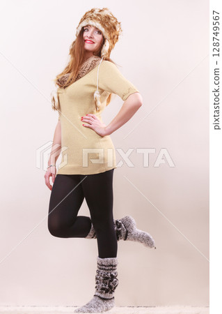 Beautiful winter woman in warm clothing Beautiful winter woman in warm clothing 128749567