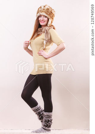 Beautiful winter woman in warm clothing 128749569