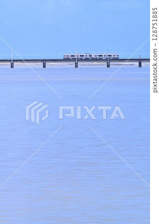 A railway bridge over the sea and a local train near Takanabe Station in Miyazaki Prefecture A railway bridge over the sea and a local train near Takanabe Station in Miyazaki Prefecture 128751885