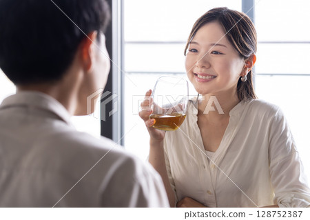 Couple enjoying a drink 128752387