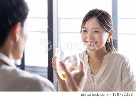 Couple enjoying a drink 128752388