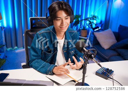 Man explaining idea in podcast recording 128752586