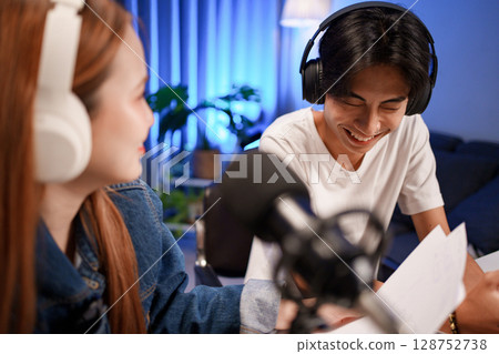 People in the podcast studio talking and recording People in the podcast studio talking and recording 128752738