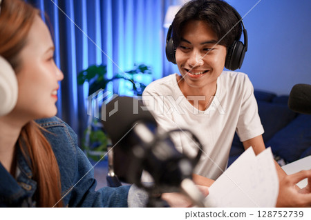 People in the podcast studio talking and recording People in the podcast studio talking and recording 128752739