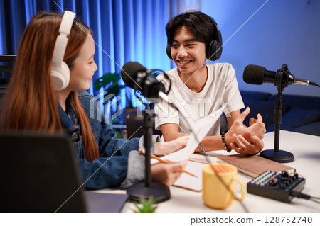 People in the podcast studio talking and recording People in the podcast studio talking and recording 128752740