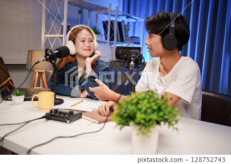 People in the podcast studio talking and recording 128752743