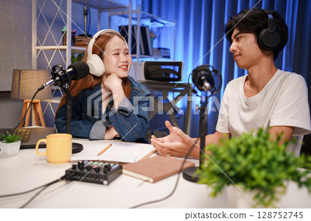 People in the podcast studio talking and recording 128752745