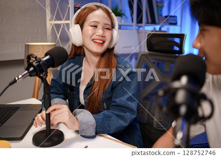 People in the podcast studio talking and recording 128752746