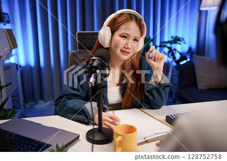 People in the podcast studio talking and recording 128752758