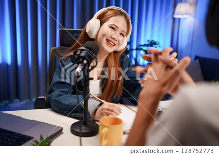 People in the podcast studio talking and recording 128752773