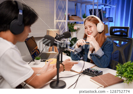 People in the podcast studio talking and recording People in the podcast studio talking and recording 128752774