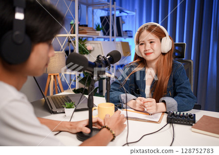 People in the podcast studio talking and recording 128752783