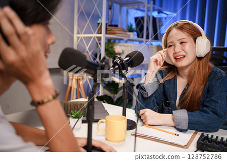 People in the podcast studio talking and recording People in the podcast studio talking and recording 128752786