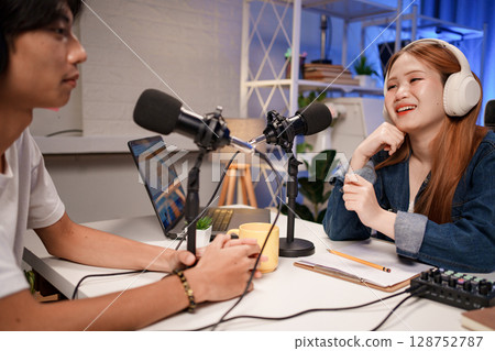 People in the podcast studio talking and recording 128752787