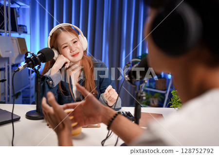 People in the podcast studio talking and recording 128752792