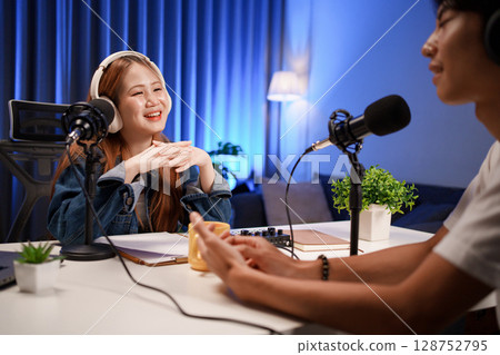 People in the podcast studio talking and recording 128752795