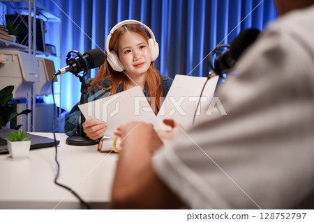 People in the podcast studio talking and recording 128752797
