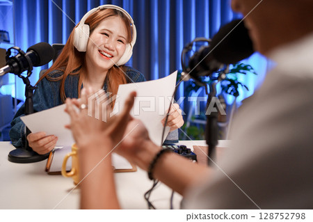 People in the podcast studio talking and recording 128752798