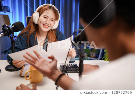 People in the podcast studio talking and recording 128752799