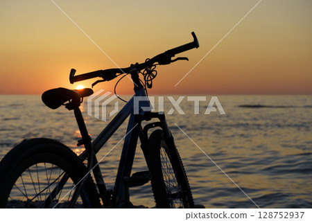 Bicycle by the Seaside at Sunset. Freedom and Tranquility 128752937