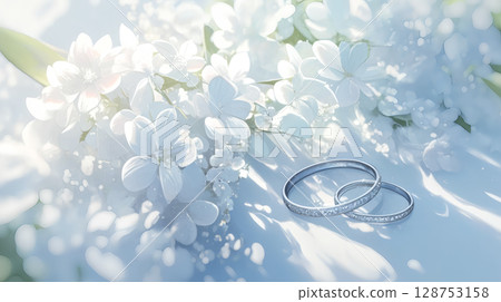 Wedding rings and white flowers Wedding rings and white flowers 128753158