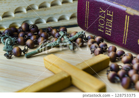 Holy Bible and Holy Rosary. Religion and Christianity concept. Holy Bible and Holy Rosary. Religion and Christianity concept. 128753375