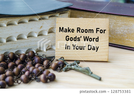 Make Room For God Word In Your Day text on wooden block with Holy Bible and Holy Rosary background. Christianity concept. 128753381