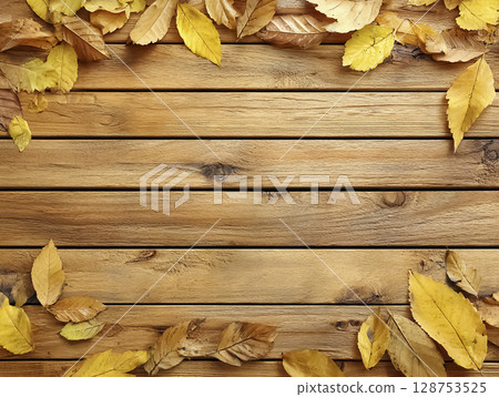 Frame image of fallen leaves arranged on a wooden board 128753525