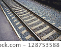 Railway Tracks on a Pebbled Bed  A Tranquil Transport Scene Capturing the Essence of Railways 128753588