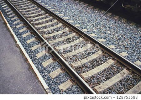 Railway Tracks on a Pebbled Bed A Tranquil Transport Scene Capturing the Essence of Railways Railway Tracks on a Pebbled Bed A Tranquil Transport Scene Capturing the Essence of Railways 128753588