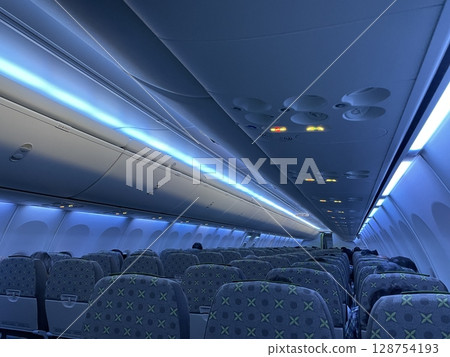 Inside an airplane at night Inside an airplane at night 128754193