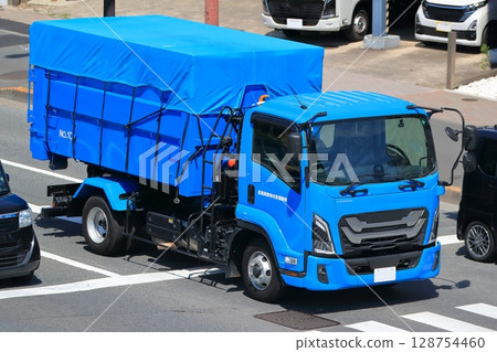 Image of industrial waste collection and transportation vehicle 128754460