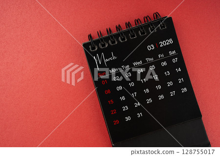 March black desk calendar for 2026 year on red cover background with copy space. 128755017