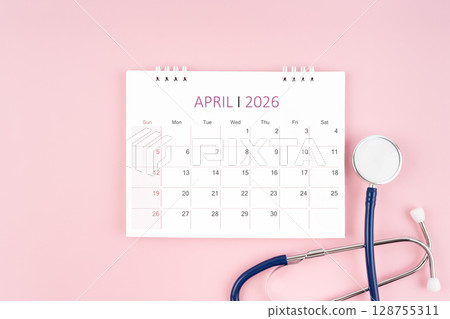 April 2026 desk calendar and stethoscope on pink background, Medical appointment concept. 128755311