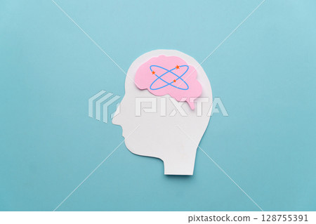 Human head with dizzy stars brain on blue background. Concept of dizziness, vertigo, headache, stress, confuse and hangover. Human head with dizzy stars brain on blue background. Concept of dizziness, vertigo, headache, stress, confuse and hangover. 128755391