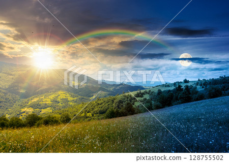 mountain landscape with wide meadow on summer solstice with sun and moon. grass on the pasture rolling through hills in countryside scenery to distant alpine valley. day and night time change concept 128755502