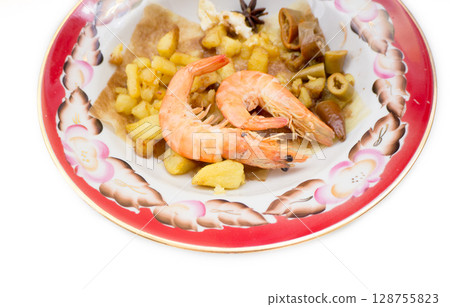 Boiled shrimps in a plate. 128755823