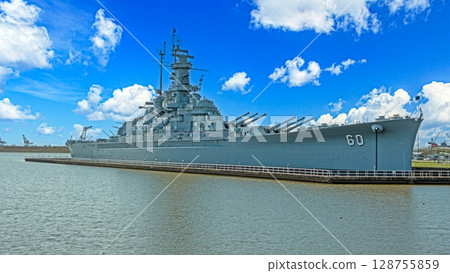 USS Alabama side profile with bright sky and water 128755859