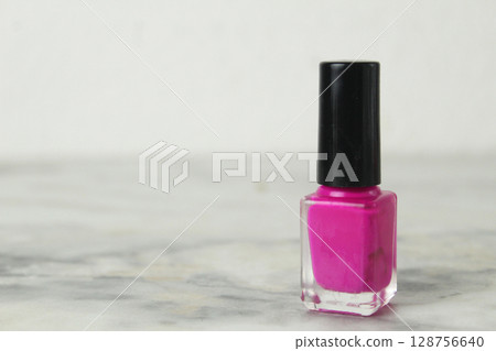 pink nail polish bottle jar with black cap on white background pink nail polish bottle jar with black cap on white background 128756640