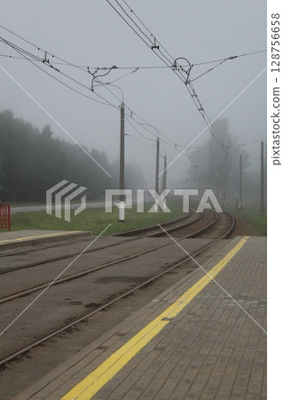 Railway, tramway, rails go into fog. Axial landscape 128756658