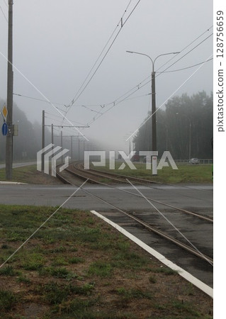 The railway is in the fog. Limited visibility due to fog The railway is in the fog. Limited visibility due to fog 128756659