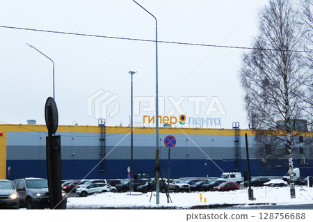 St. Petersburg, Russia, 01 2024: Lenta Hypermarket on the Background of Snow 128756688